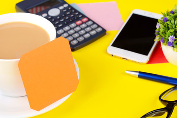 Empty note paper with coffee and calculator