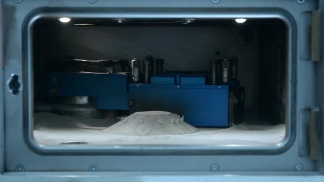 Printing platform object printed on 3d printer for metal in open working chamber. 3D printer printing metal. Laser sintering machine for metal. Progressive modern DMLS, SLM, SLS additive technology