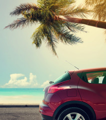 Fototapeta na wymiar Summer car and background of palms and sea. 