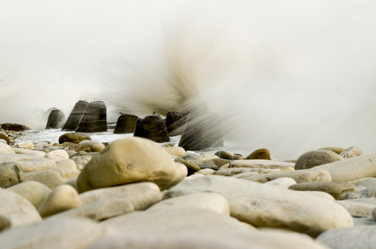 Fototapeta Storm on the beach with a long exposure
