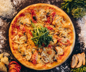 Food ingredients and spices for cooking  delicious italian pizza in a black concrete background. Copyspace Top view Banner.