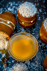 Close up of ayurvedic home remedy for smooth and thick hair i.e. rice water on wooden surface.