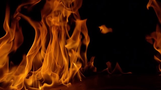 Flames of fire on black background in slow motion