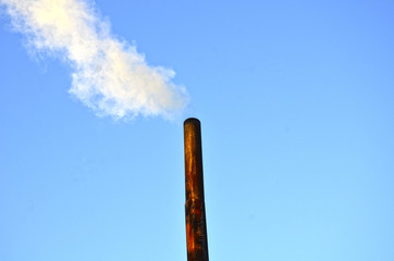 The smoke from the chimney. Plant. Factory chimney. Bad ecology. Pollution of the environment ....