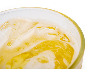 Pouring beer with bubble froth in glass for background.