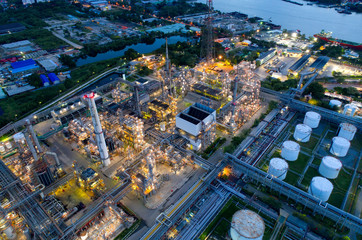 Aerial view of twilight of oil refinery ,Shot from drone of Oil refinery and Petrochemical plant at dusk , Bangkok, Thailand