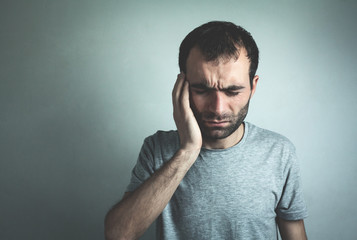 Caucasian man having a headache.