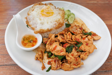 Thai street food on white dish with fried egg and fish sauce 