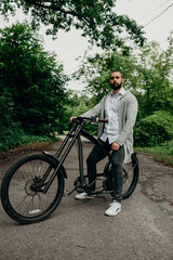 Man riding a bicycle in city park. Vacations and relax time