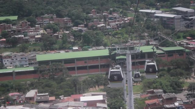 Cabins of the Medellin metrocable and view of the city in the background