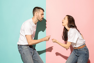 A couple of young man and woman dancing hip-hop at studio.