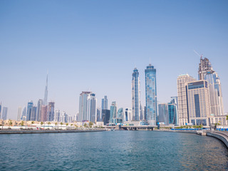 Fototapeta na wymiar Panorama of the city of Dubai from the bridge of the river channel Dubai Creek
