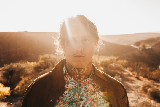Stylish tattooed man at summer