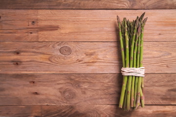 Fresh asparagus on wooden surface