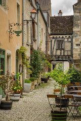 Fototapeta na wymiar View down a street in the beautiful town of Noyers sur Serein in Burgundy