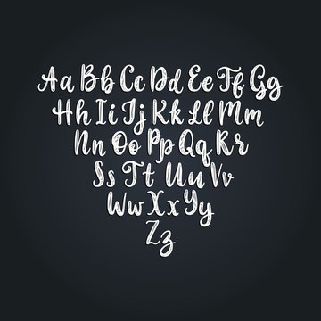 Calligraphic straight font letters on black background.Vector hand lettering alphabet.
