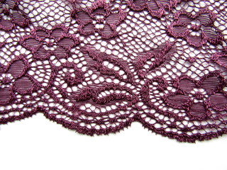 Dark lace fabric with festoons on white background