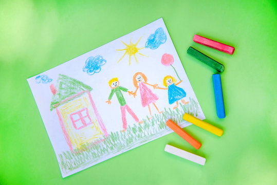 A child's drawing of family and house