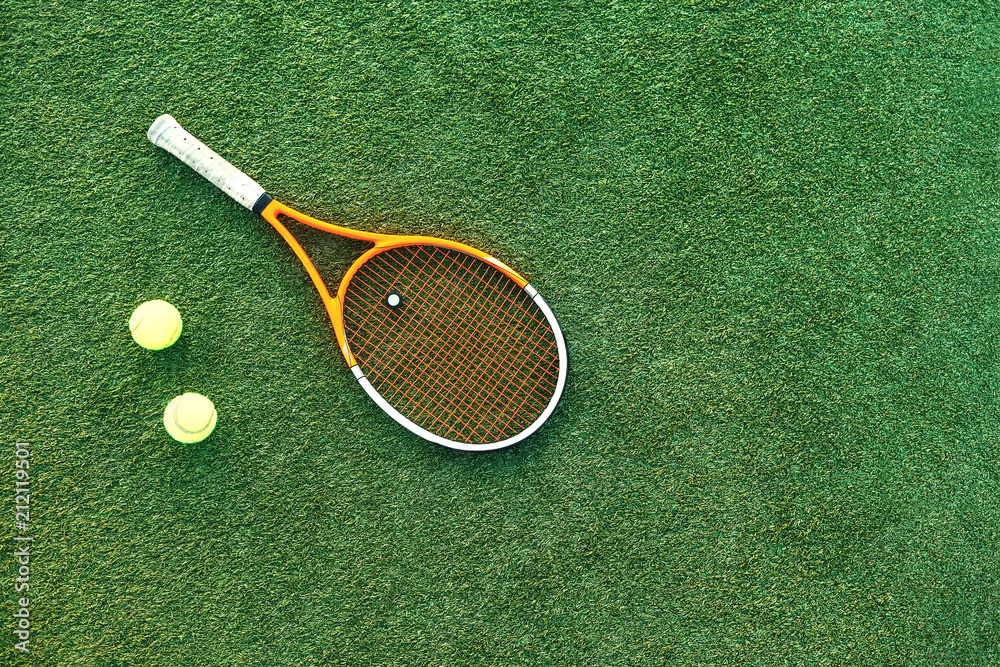 Sticker tennis ball and rackets on grass