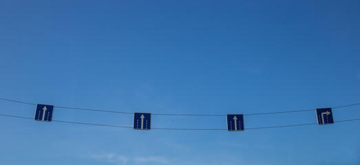 signs direction signs on a blue sky background