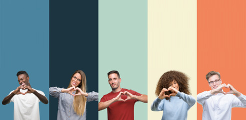 Group of people over vintage colors background smiling in love showing heart symbol and shape with...