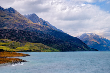 Colorful mountains and dramatic sky at Lake Wakatipu, Queenstown, NZ