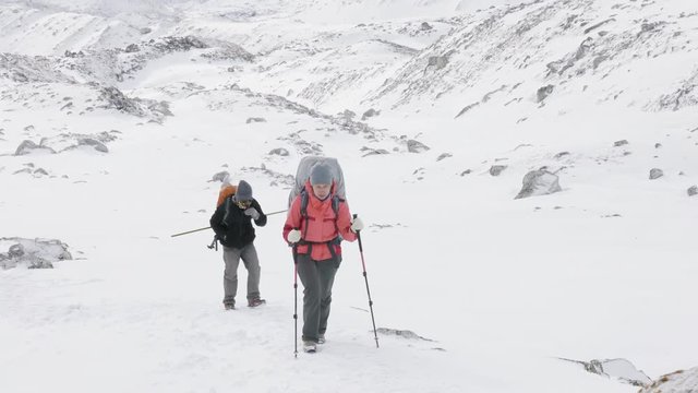 Backpackers on Larke Pass in Nepal, 5100m altitude. Manaslu circuit trek area.