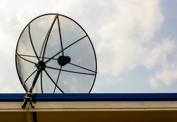 Black satellite dish attached on the roof with coppy space