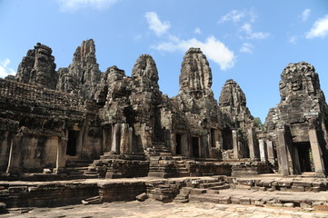Fototapeta na wymiar The Bayon is a well-known and richly decorated Khmer temple at Angkor in Cambodia. Built in the late 12th or early 13th century as the official state temple of the Mahayana Buddhist King Jayavarman VI