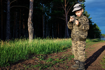 kid using phone outdoors