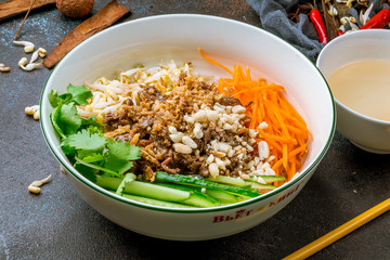 Beef with sliced carrots, bean sprouts and cucumbers