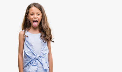 Brunette hispanic girl sticking tongue out happy with funny expression. Emotion concept. © Krakenimages.com