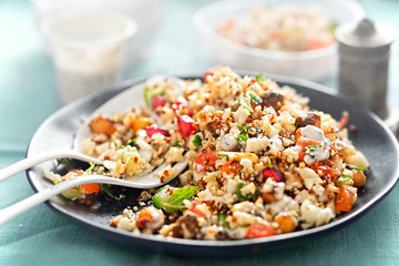 Cauliflower, quinoa & harissa spiced chickpea salad with feta and mint dressing 