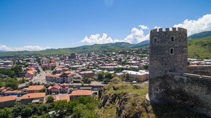 Fototapeta na wymiar ancient fortress tower against the background of the city
