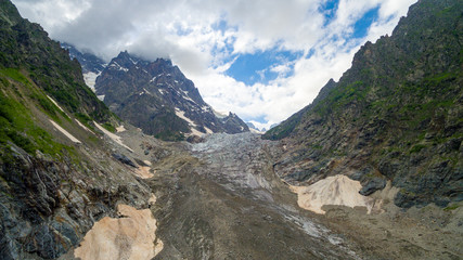 Gorge and high mountains with clouds