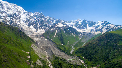 Glacier Shkhara aerial view in sunny day