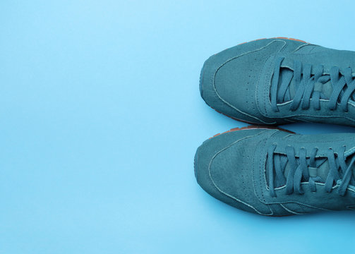 One Pair of blue sport shoes on blue background