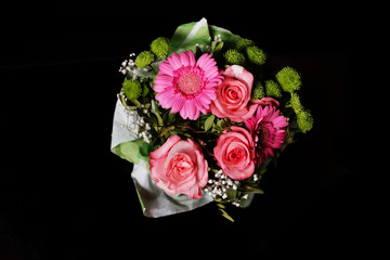 Bouquet of pink flowers with black background