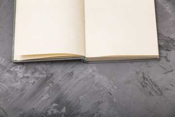 open old book on a gray background. view from above