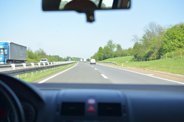 Driving on a highway that goes through a beautiful countryside in springtime