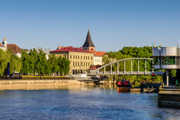 Cityscape of Tartu. The historical city center and the Emajogi river in a sunny day, Estonia