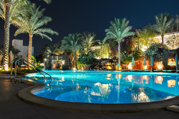 Swimming pool at night in one of the hotels near beach, Sharm El Sheikh, Egypt