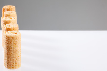 Wafer rolls. Gtoup of tasty crispy tube wafer on white background. Dessert