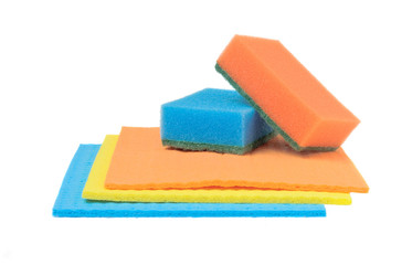 Sponge for washing dishes and rags for a table on a white background