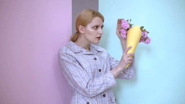 Upset woman with bouquet of roses. Girl is upset with bouquet which was presented to her