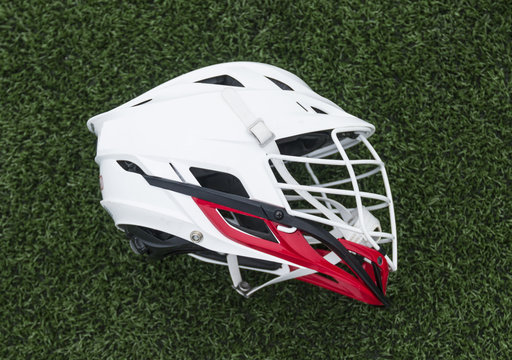 Red and white lacrosse helmet - Powered by Adobe