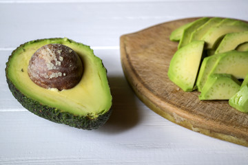 Sliced avocado. Healthy food. Tasty vegan breakfast.