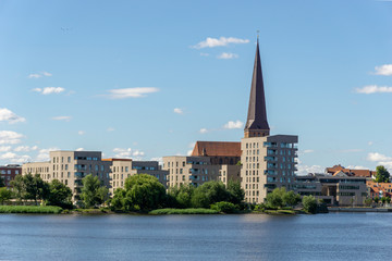 view over the river warnow - skyline of Rostock with Petri church in the background 