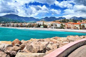 Fototapeta na wymiar Panoramic view of promenade and old medieval town with multicolored houses of Menton,luxury Cote-d-Azur.French Riviera,Europe,France