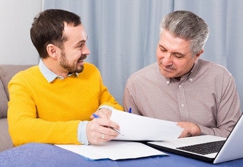 Man and sales manager discuss contract